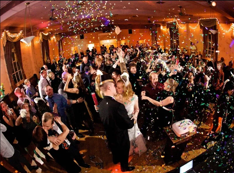 New Year's Eve celebration with confetti and dancing couple